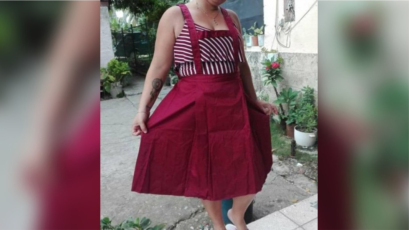 Se vuelven virales las imágenes de esta madre cubana probándose el uniforme escolar que le dio el Gobierno para su hija de solo cinco años
